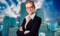 Successful businesswoman with folded arms Are leaders born or raised?