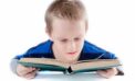 Boy reading a book Helping young learners bounce back from COVID disruptions